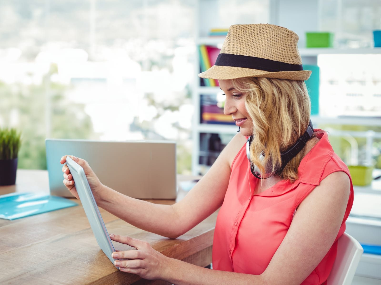 A travel specialist checking a schedule on a tablet.