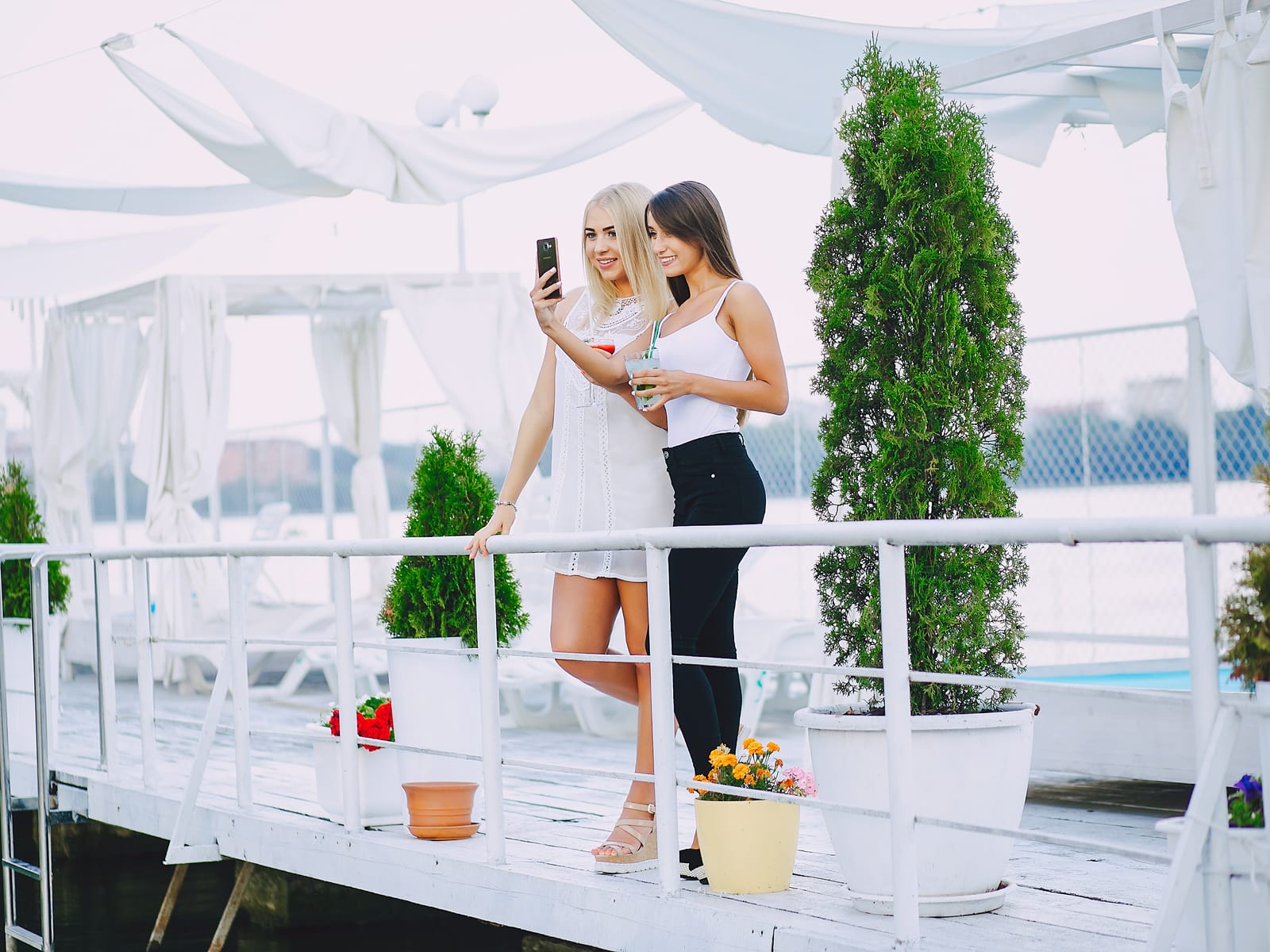 Guests on a hospitality terrace overlooking a circuit.